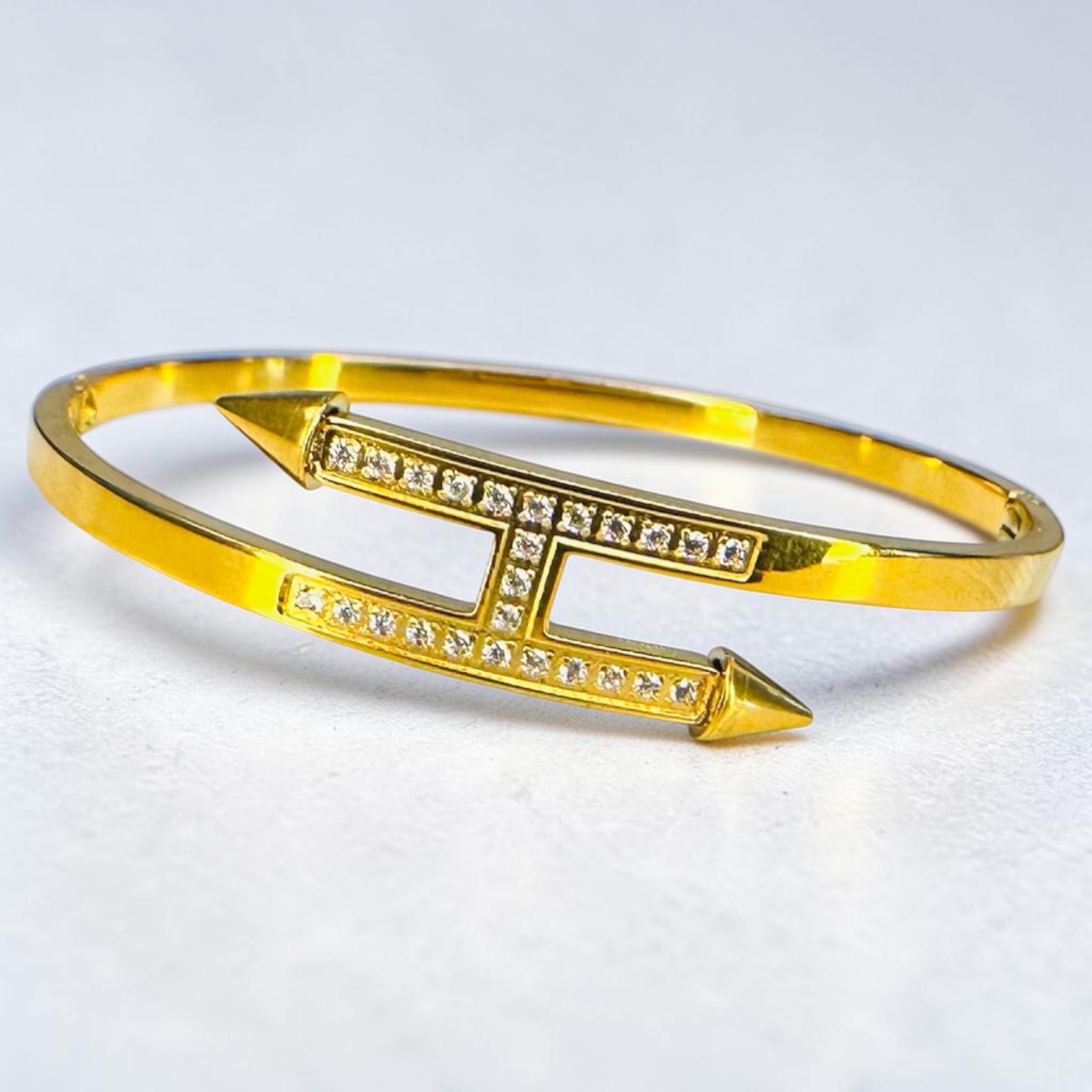 Everlasting Modern Jewelry gold-tone cuff bracelet with geometric arrow ends and pave set cubic zirconia stones.